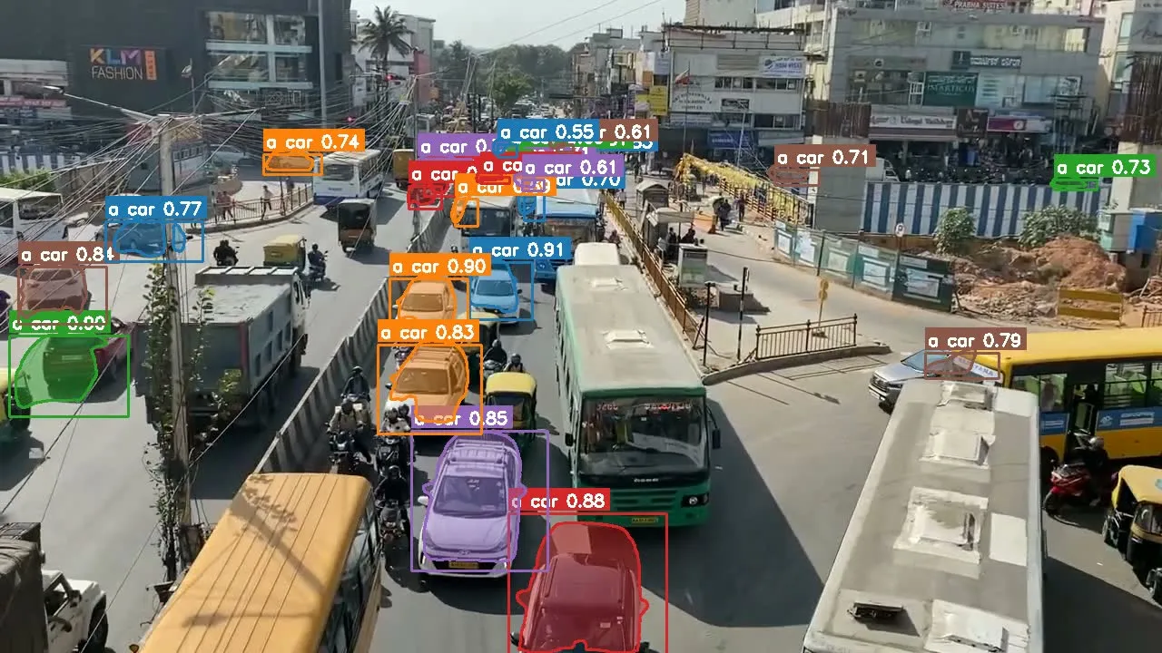 Another frame: overlapping vehicles still get distinct masks and scores—continuity matters more than a single-frame count